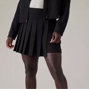 ATHLETA NWOT Endless Black Skort Zipper Closure Pockets Size 10 Tennis Golf